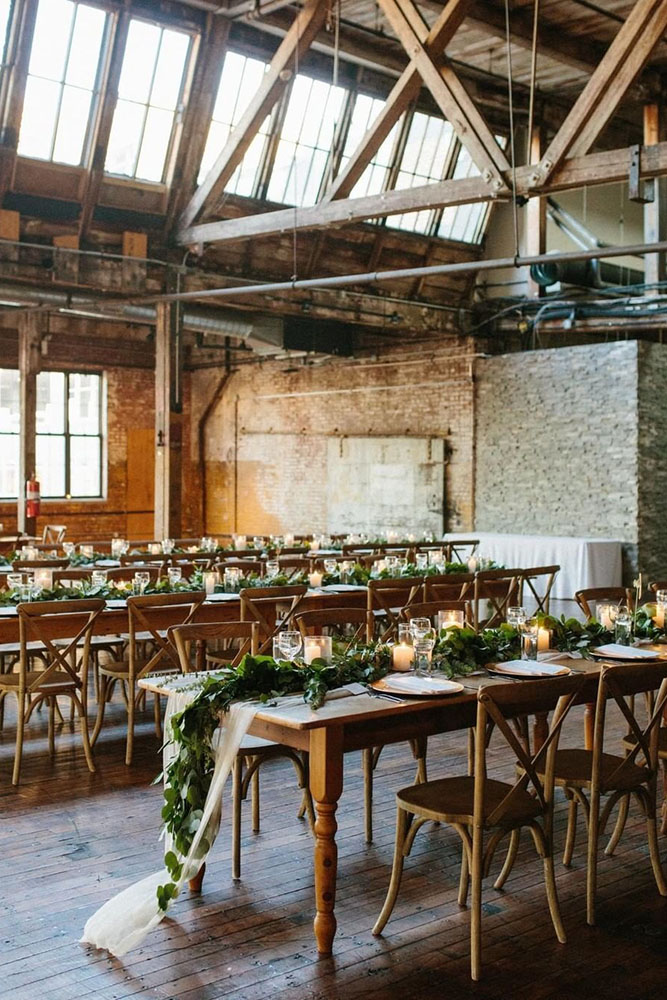 loft decorating ideas rustic reception with table greens and candles nicki sebastian