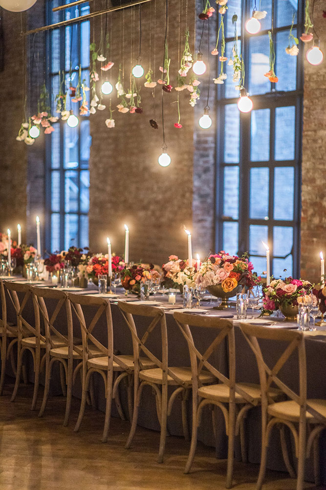 loft decorating ideas and candles over the table flowers and light bulbs leila brewster