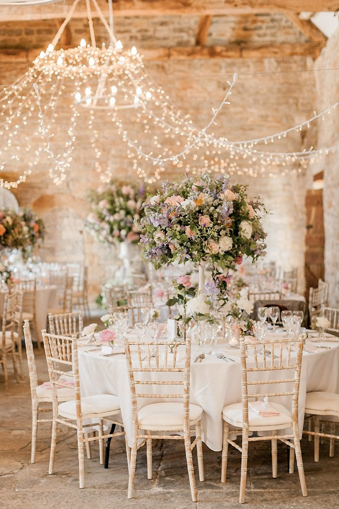 loft decorating ideas wedding reception in a loft with round tables and high vases naomi kenton