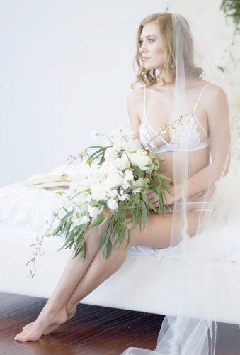 wedding boudoir book bride with bouquet quiannamariephotography