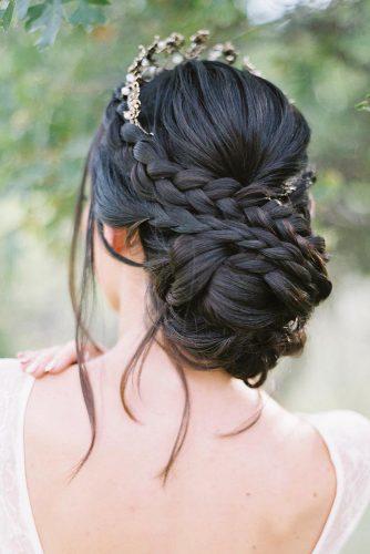 wedding updos with braids chignon on dark hair with loose curls hairandmakeupbysteph