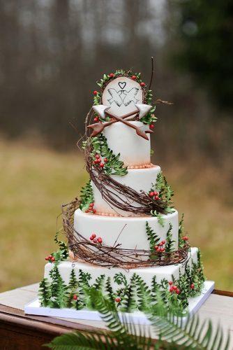 woodland themed wedding cakes tall white with greenery and birds on top ooh la la cupcakes