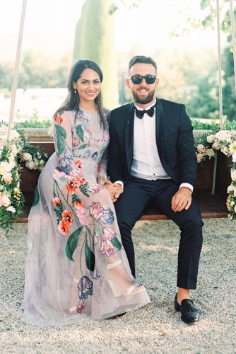 zeynab kanso wedding guests sit on a swing joseba sandoval