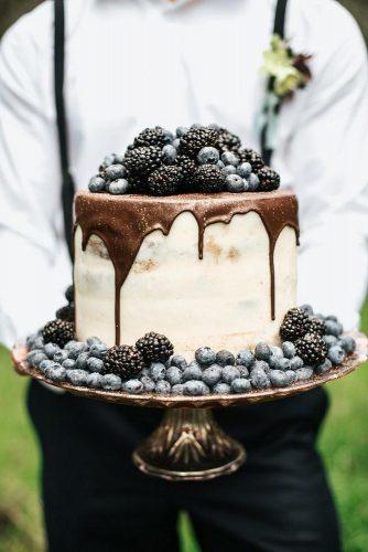 drip wedding cakes small white bronze drip with berries monique serra photography