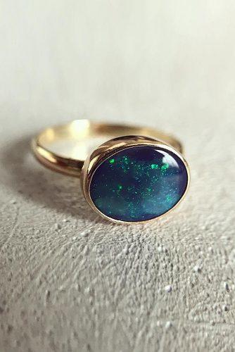 opal engagement rings rose gold oval cut black opal