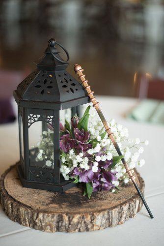 rustic wedding lanterns centerpiece with lilac flowers on wood circle kate & co photography