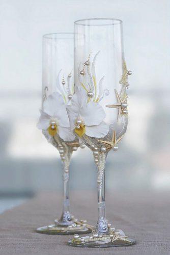 wedding glasses with orchids pearls and starfish irene_irene7 via instagram