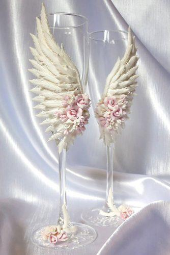 wedding glasses with pink clay roses and white wings olgagusevaart via instagram