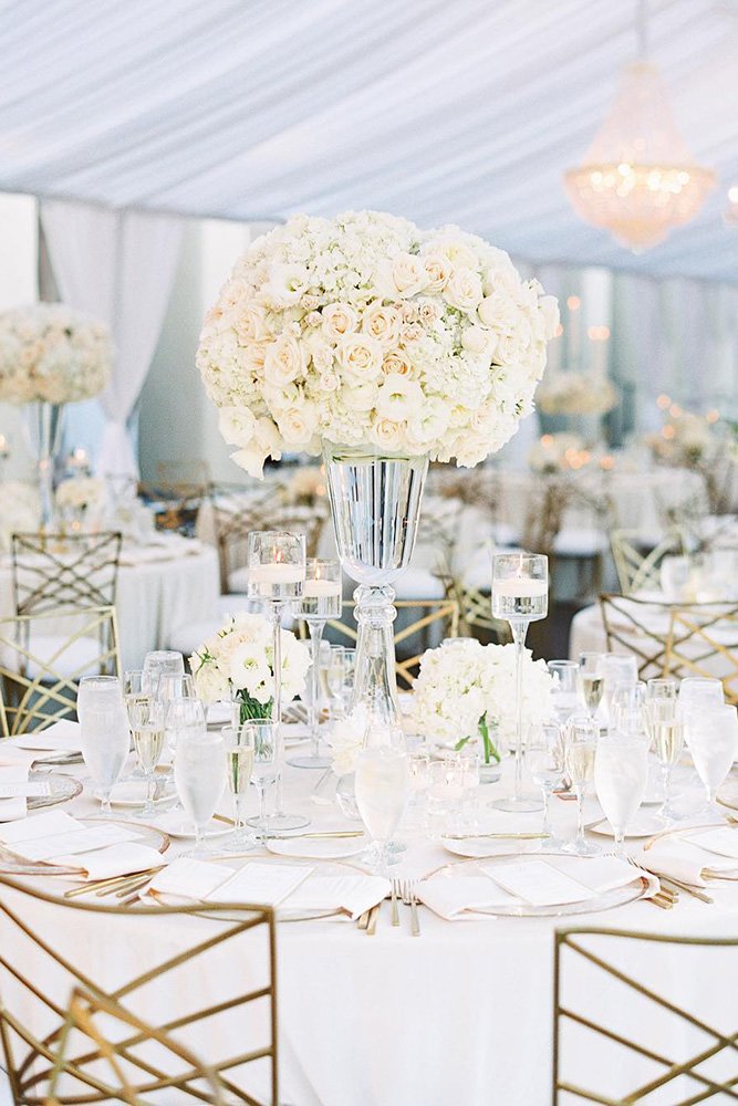 wedding tent all white reception with tall flower centerpiece the grovers via Instagram