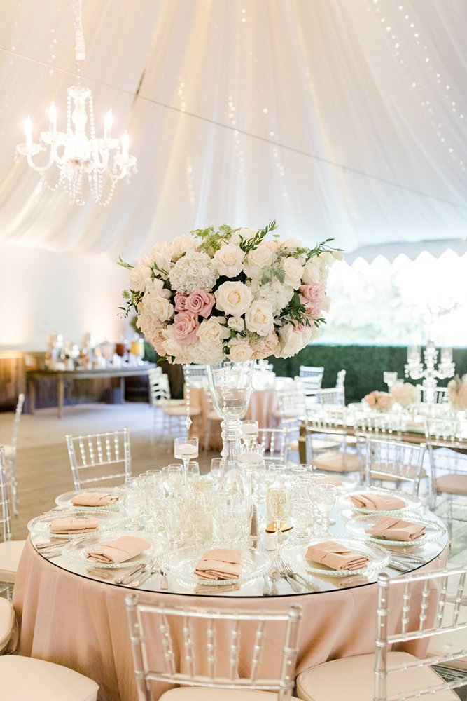 wedding tent blush white roses greenery glass tall vase on round table jenny quicksall photography