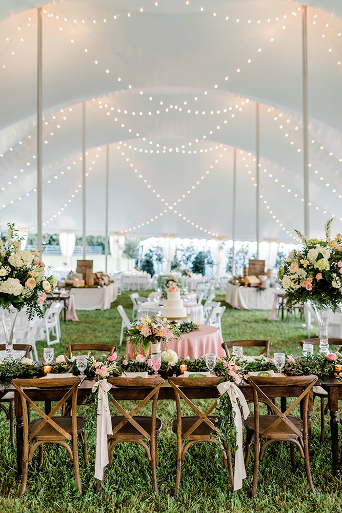 wedding tent elegant pink flowers on wooden tables rustic white photography