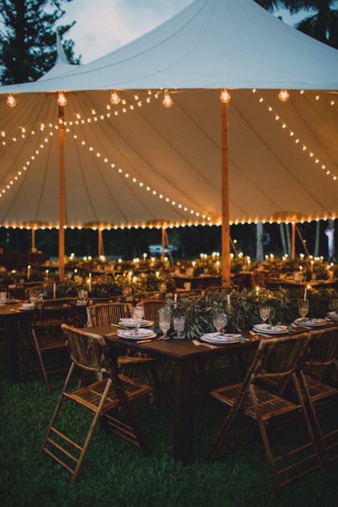 wedding tent outdoor reception with lightings and greenery and candles maui maka photography