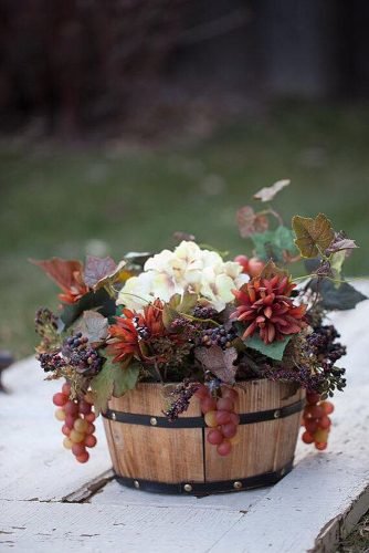 wine barrels table centerpieces grape and flowers