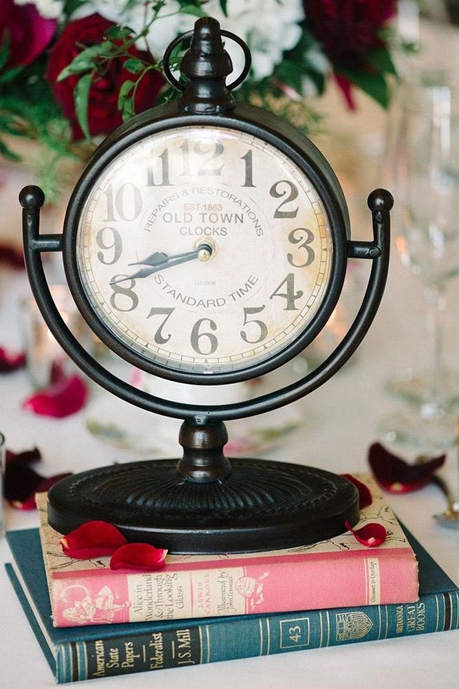disney wedding centerpiece with books and clock michelle lange photography