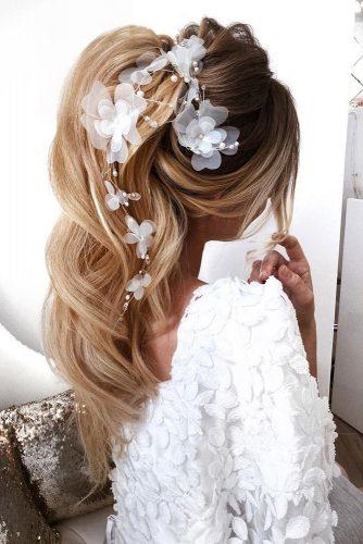 elstile wedding hairstyles elegant ponytail textured curly on blonde hair with white flowers elstile