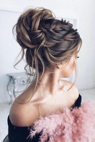 elstile wedding hairstyles high bun with loose curls and braids