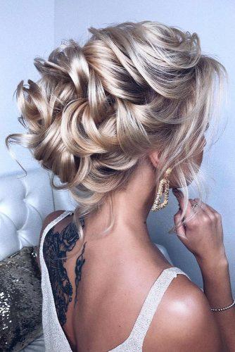 elstile wedding hairstyles high updo with loose curls on blonde hair