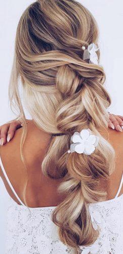 favorite wedding hairstyles long hair blonde braid with white flowers modernsalon