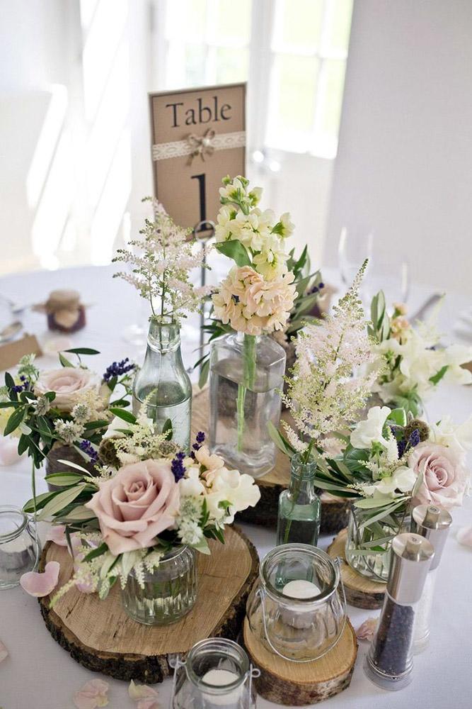 rustic wedding centerpieces on wooden slice glass vases with pink roses mark tattersall