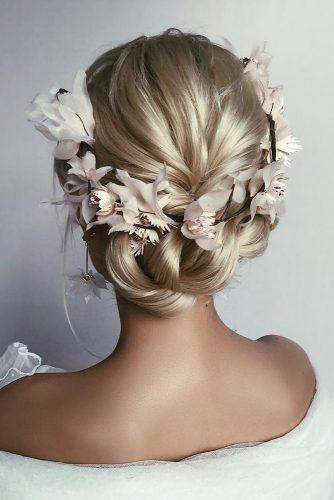 rustic wedding hairstyles updo on blonde hair with braid and flower crown caraclynebridal
