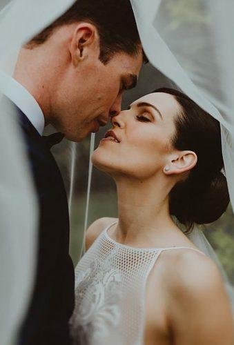 couple poses couple under veil olguinphotography