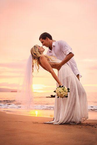 beach wedding romantic sunset newlyweds