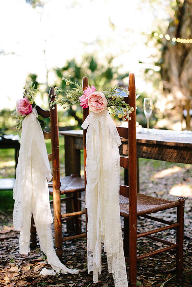 bohemian decor ideas white cloth and blush flowers decorate chairs becca borge