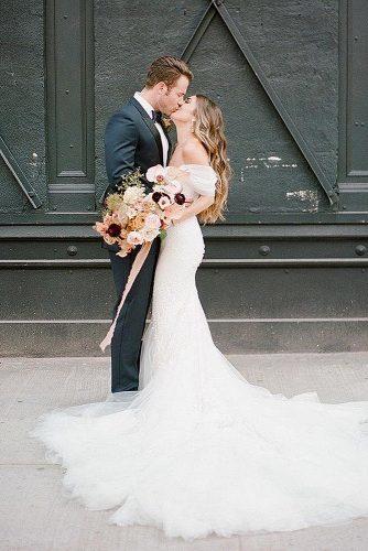 wedding splurges bride and groom kiss reception