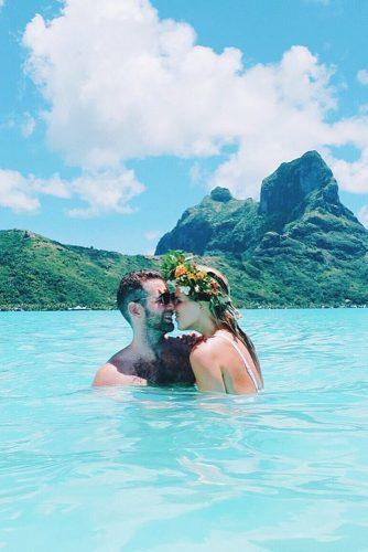 wedding splurges romantic couple in the water honeymoon
