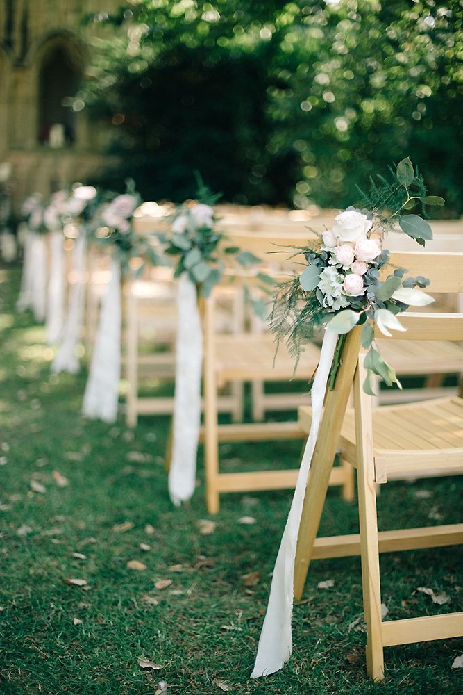 wedding aisle decoration ideas flower clusters with gentle pink flowers clusters and white stripes m and j photos