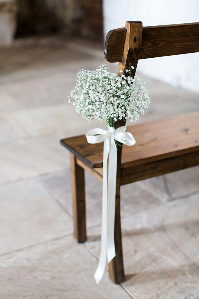 wedding aisle decoration ideas white stripe bow with baby breath flowers helen cawte photography