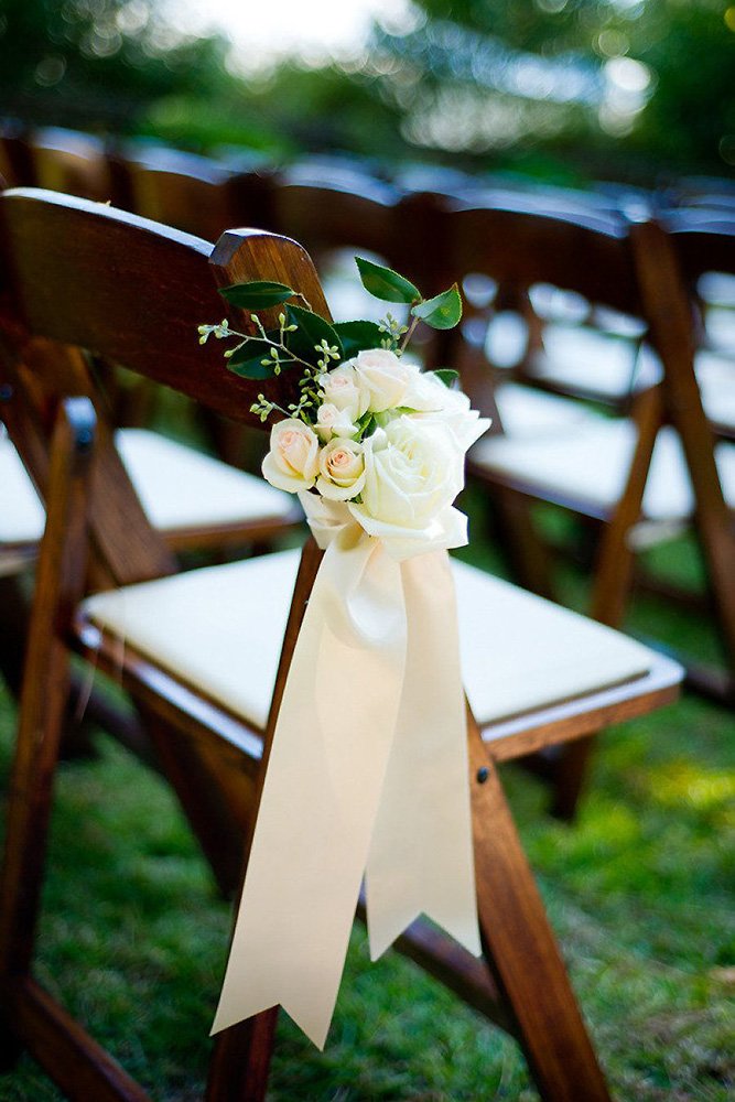 wedding aisle decoration ideas with gentle roses and white stripes pew bow heather forsythe photography