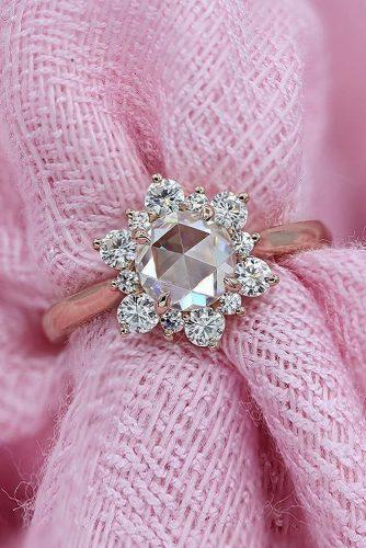 top engagement ring ideas floral halo round cut diamond rose gold moissanite
