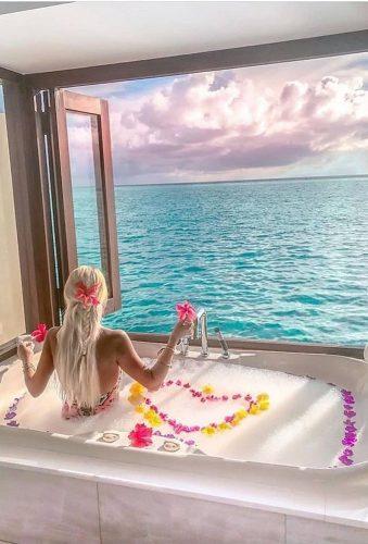 unique honeymoon destinations girl near window fashionlife word