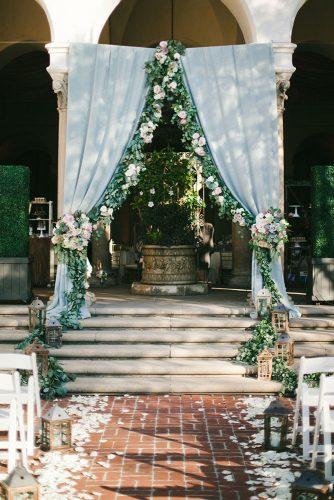 tiffany blue wedding decorations altar with cloth flowers and greenery onelove photography