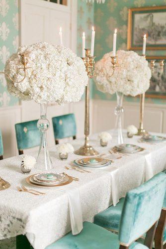 tiffany blue wedding decorations elegant reception with tall white flowers centerpieces and velvet chairs arte de vie