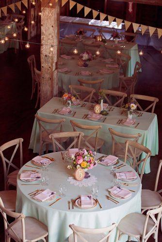 tiffany blue wedding decorations for rustic reception in barn with flowers and woodland table number on tables dreamlove photography