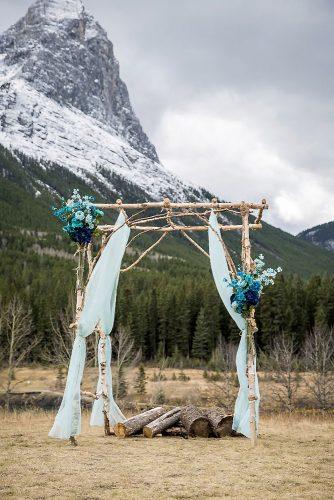 tiffany blue wedding decorations outdoor wedding altar with cloth and flowers kim payant photography