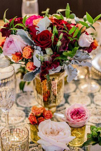 arabic wedding blowers in gold vase on wedding table madi photograph