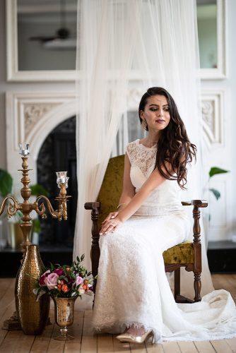 arabic wedding bride in lace dress and gold shoes seatins in armchair madi photograph