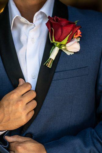 arabic wedding grooms look detail with red rose boutonniere madi photograph