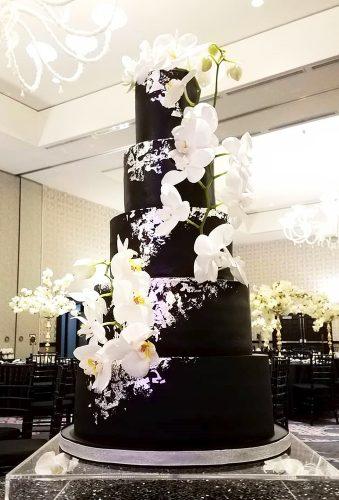 black wedding cake white flower casacade on the cake luxsucredesserts