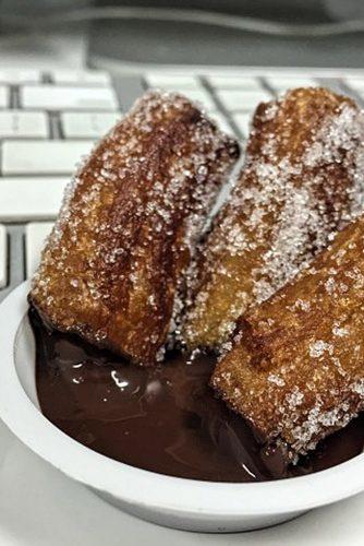 churros dipped in chocolate mexican dessret