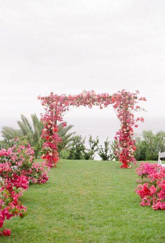 destination weddings decorations red arch Lacie Hansen Photography