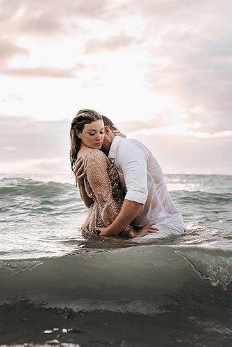 beach photoshoot stylish photoshoot couple tense in the sea