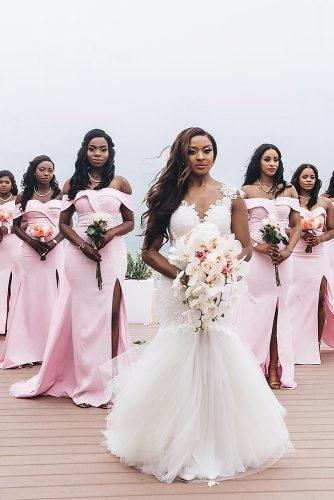 real wedding cindy glen black bride with hair down in lace dress with cascading bouquet with her bridesmaids in pink dresses with small bouquets stanlo photography