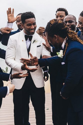 real wedding cindy glen black groom best men congratulate the groom stanlo photography