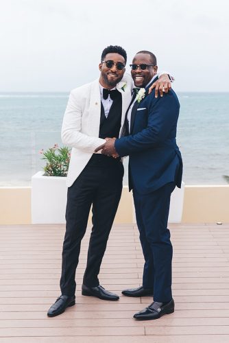real wedding cindy glen black groom in black white suit and best man in sun glasses stanlo photography