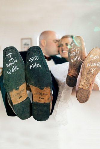 wedding shoe ideas written on the soles groom and bride blackmountainweddings