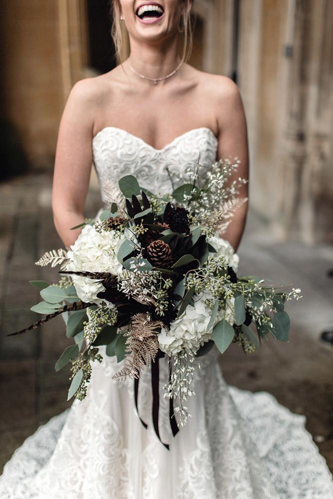 christmas wedding white and green bridal wedding bouquet with cones rebecca searle